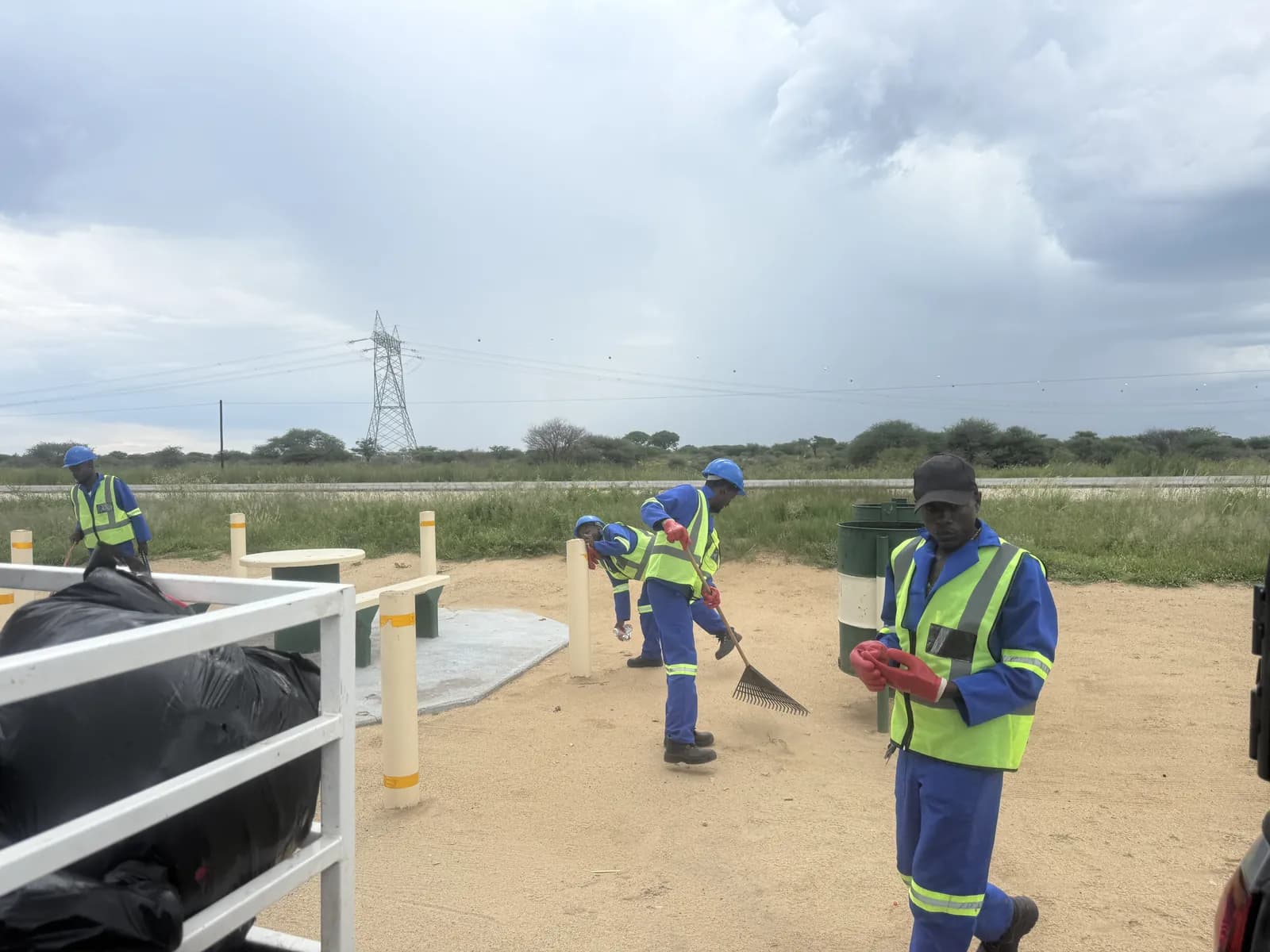 Crew clearing a roadside during community cleanup work