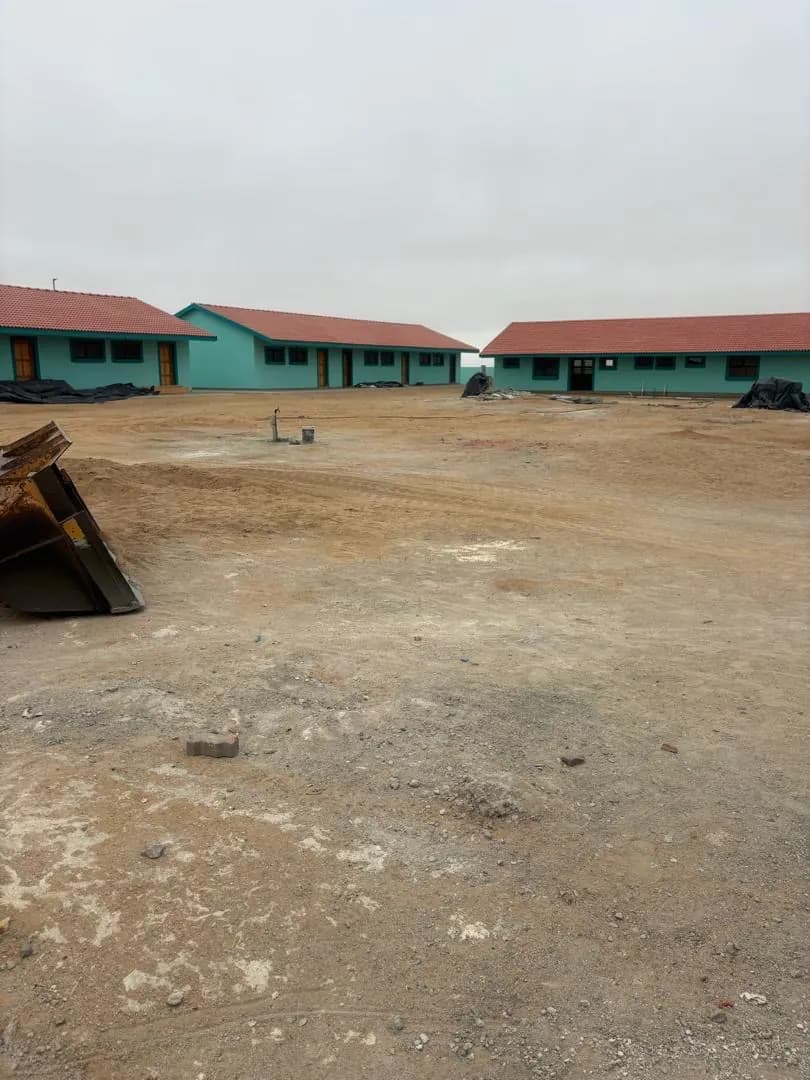 Site entrance route with graded sand ahead of the new school blocks in Henties Bay