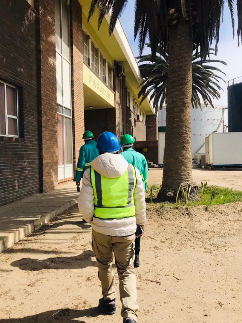 Team walking between facility buildings