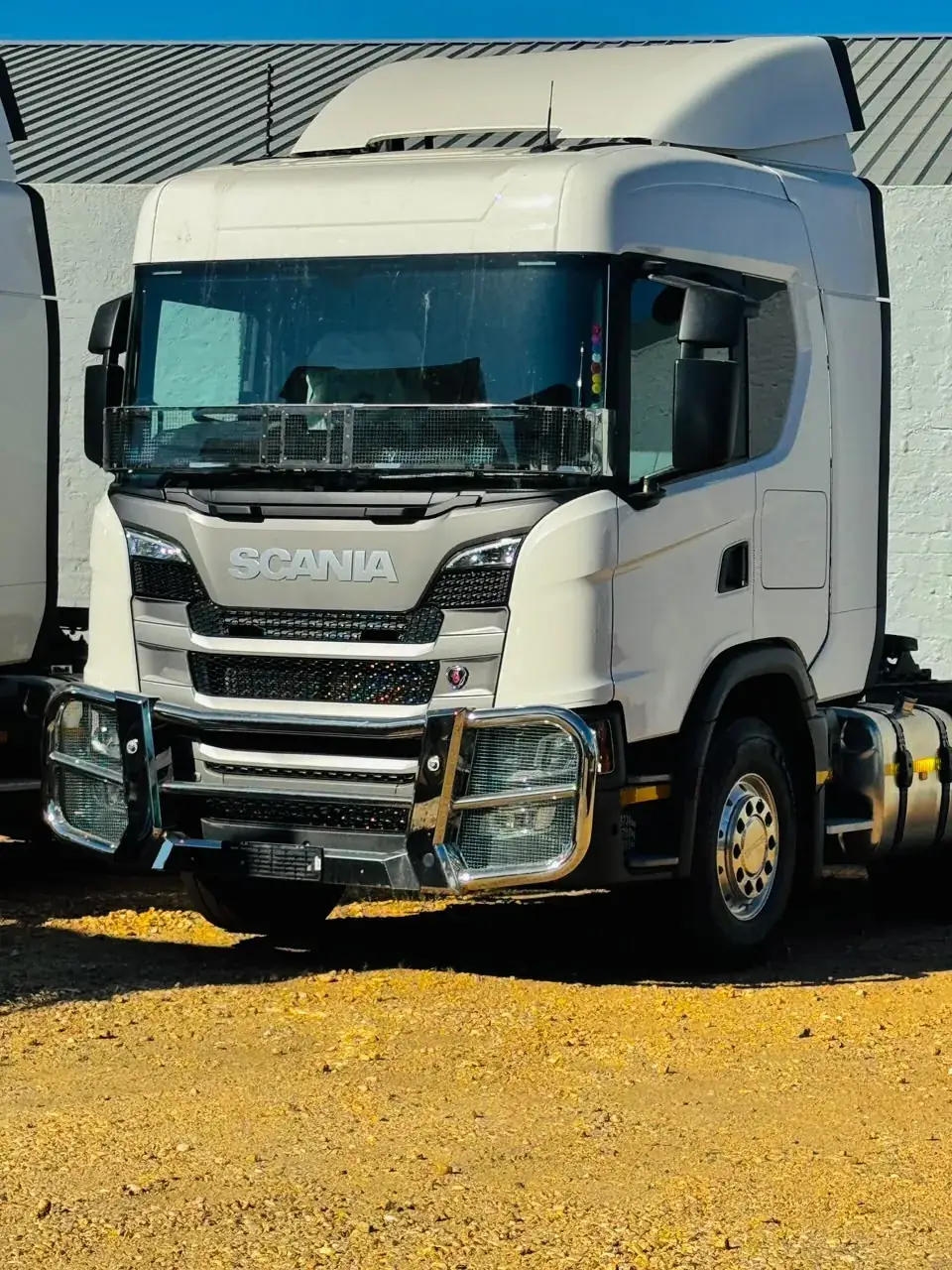 Heavy truck front view at a depot yard