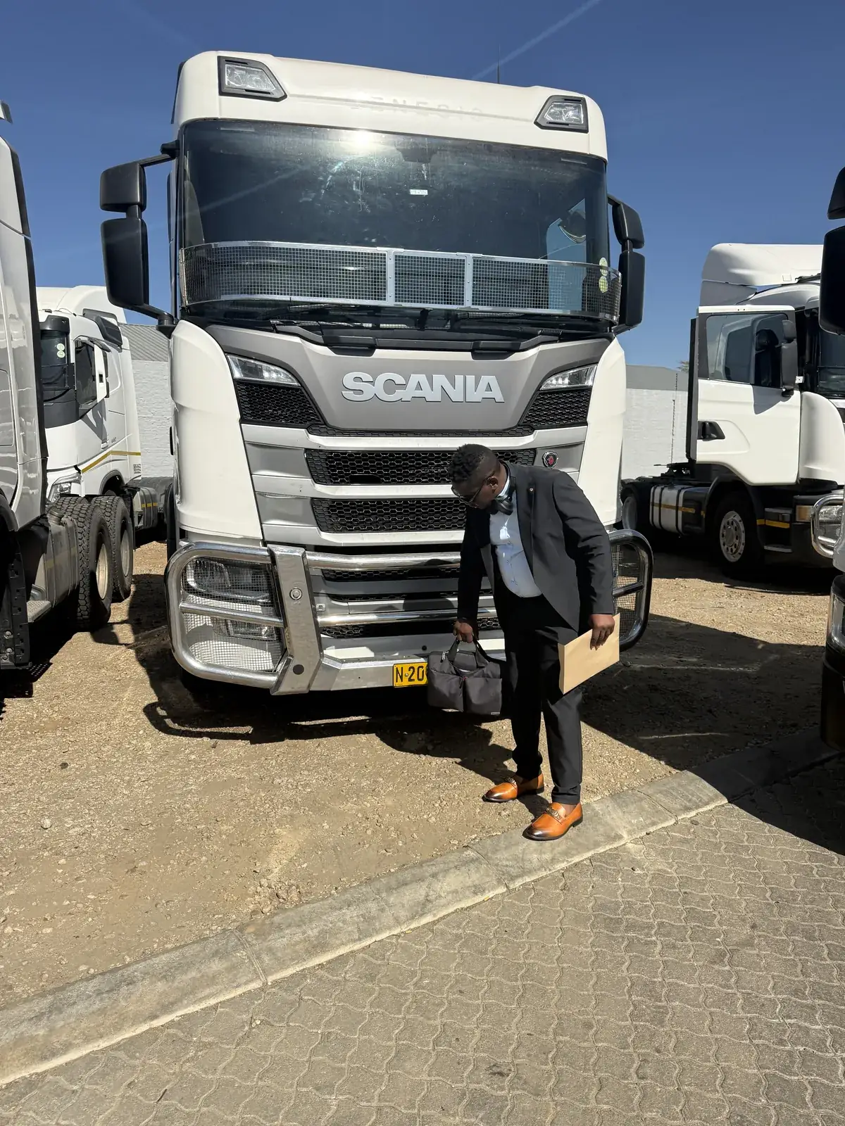 Truck fleet lined up at a depot before dispatch