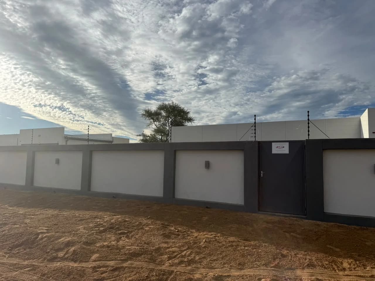 Electric fencing on a precast boundary wall, alternate view