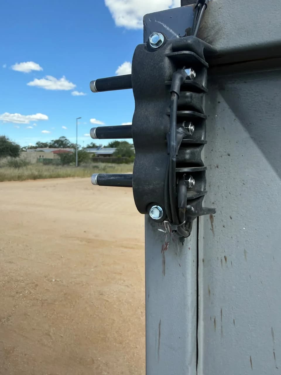 Close view of an insulator and electric fence wire