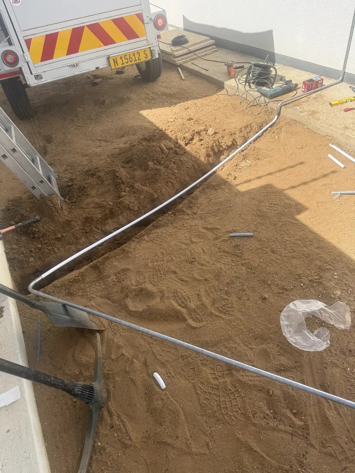 Cable and trenching work beside a service vehicle