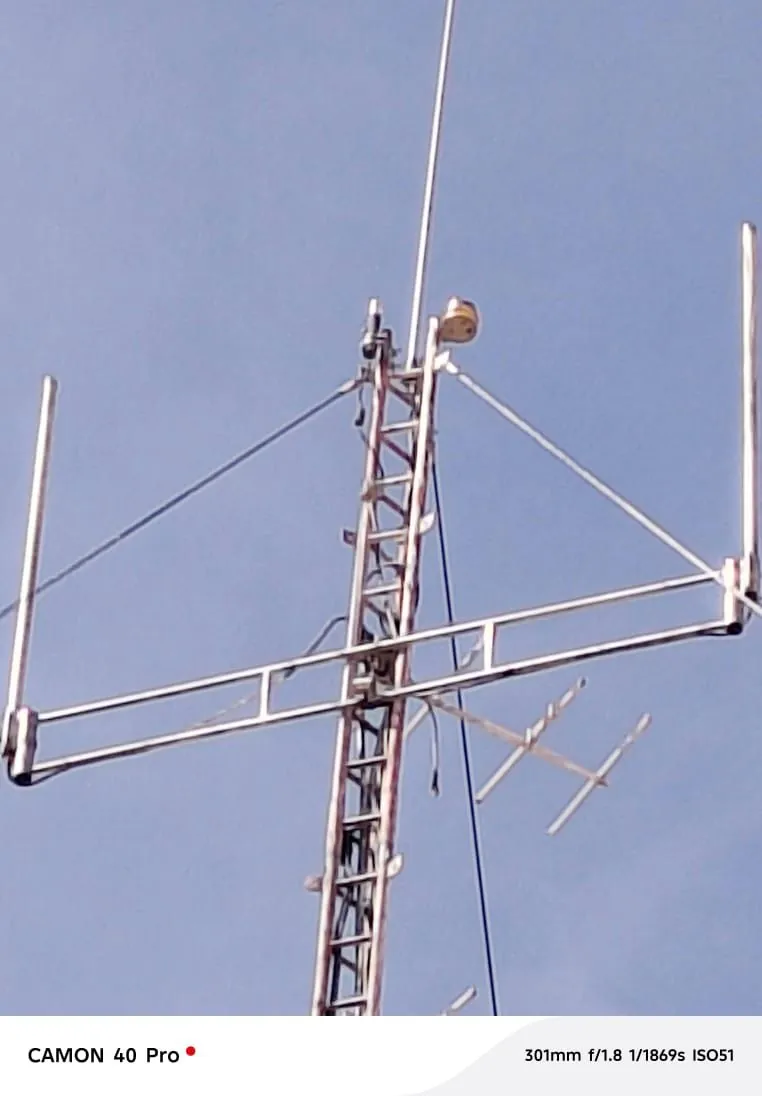 A communications antenna structure against the sky