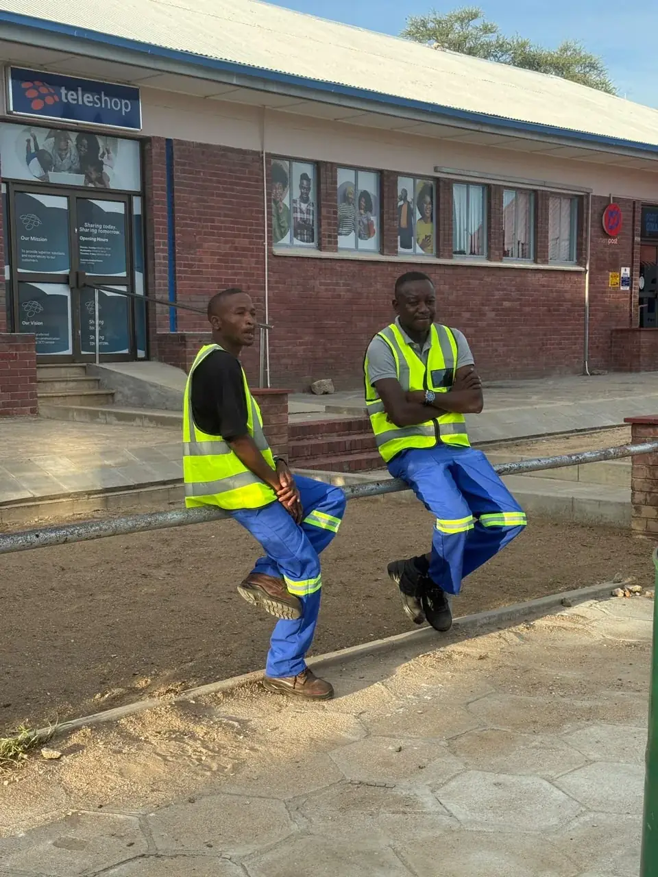 Mendozer crew members in branded high-visibility site wear